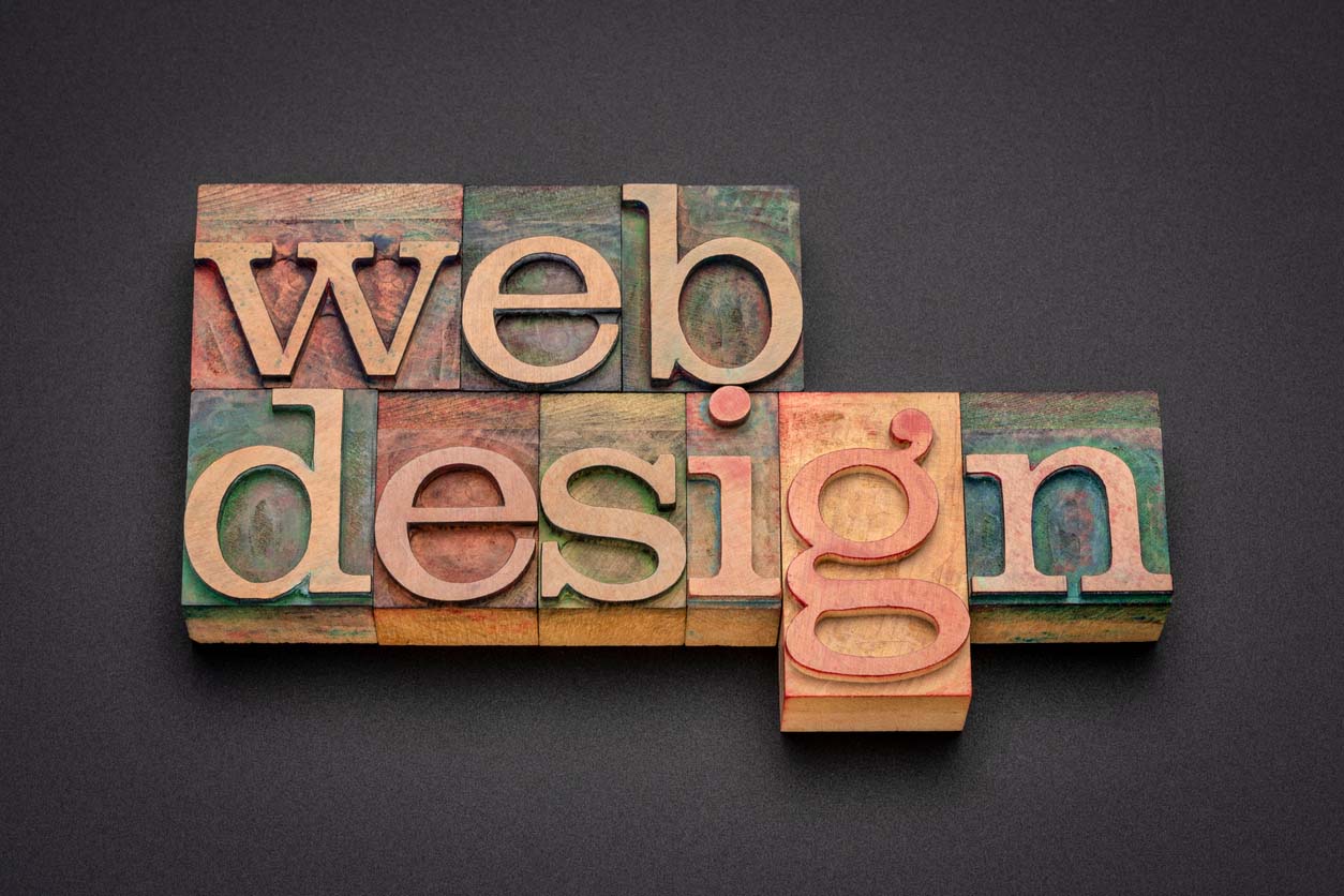 blocks in wood spelling website design in an article about website design costs
