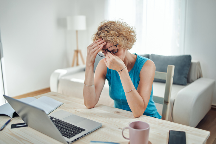 woman working on computer and feeling frustrated
